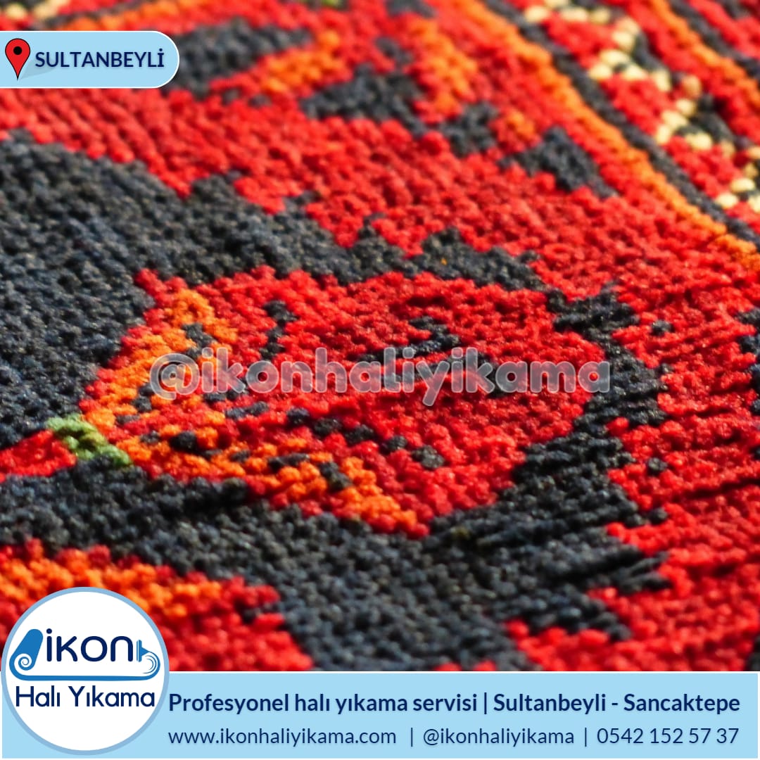 Kırmızı, siyah ve turuncu desenli halı detayı